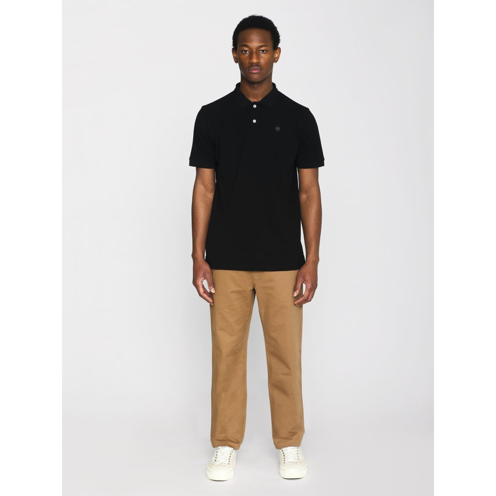Polo brodé en coton bio | noir "toke basic badge polo black jet"