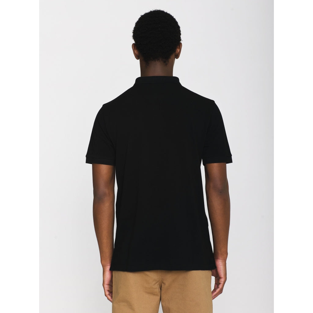 Polo brodé en coton bio | noir "toke basic badge polo black jet"