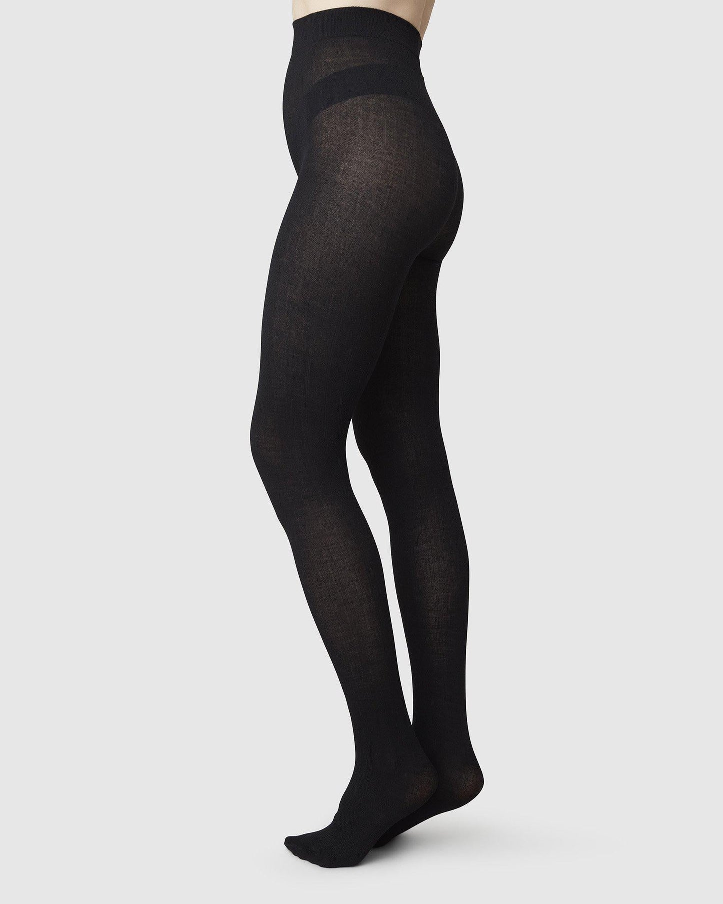Collants en mélange de laine certifiée et matières recyclées | noir "ylva organic wool fishbone"
