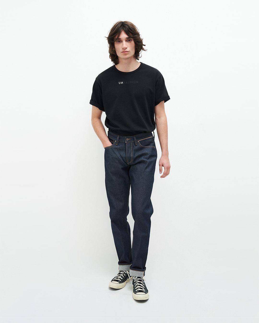 Jean droit fuselé en coton recyclé | bleu brut "jim regular slim orange selvedge recycled raw"