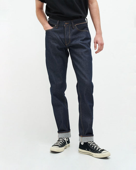 Jean droit fuselé en coton recyclé | bleu brut "jim regular slim orange selvedge recycled raw"