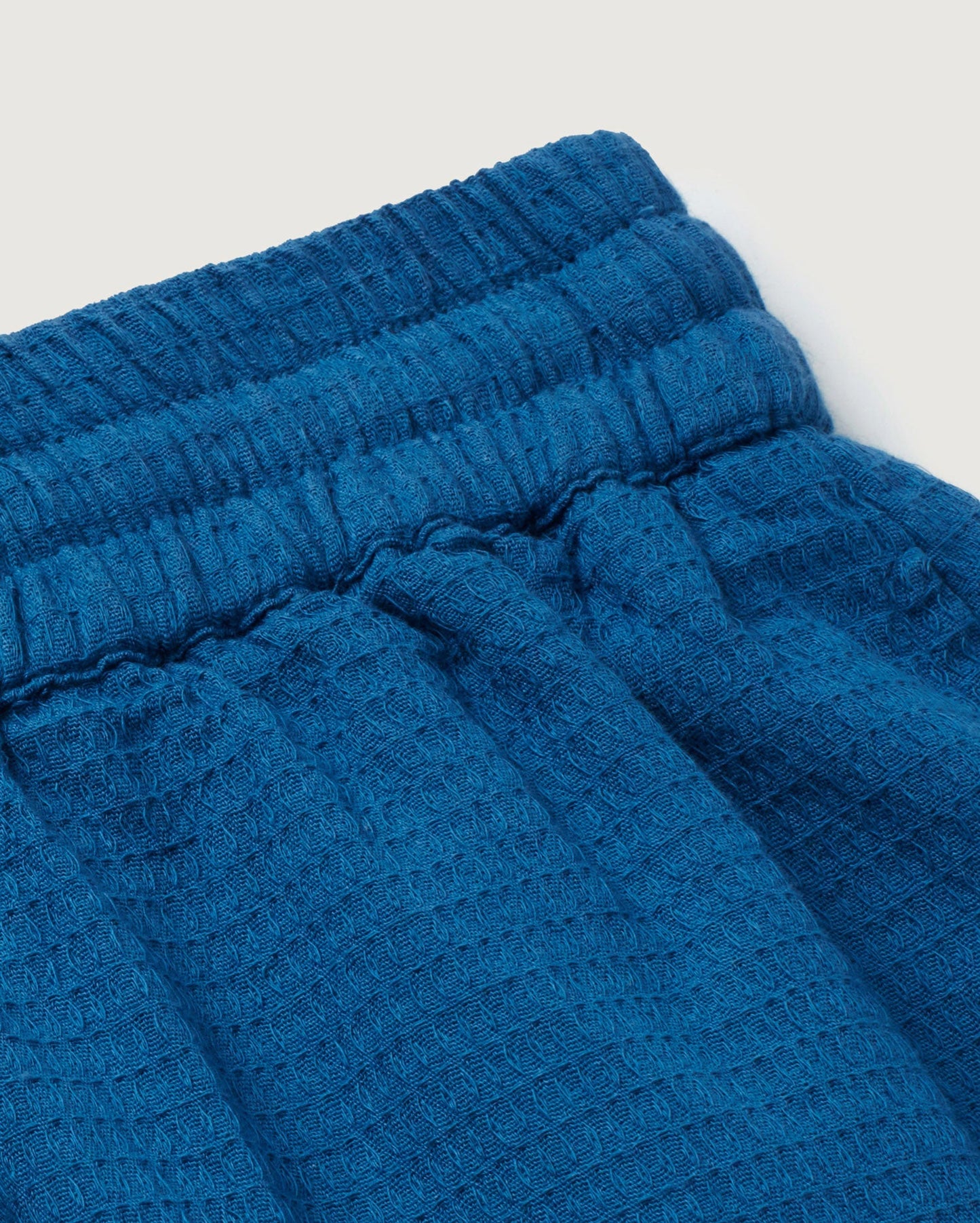 Short texturé en coton bio | Bleu "dark heritage loop geranio shorts"